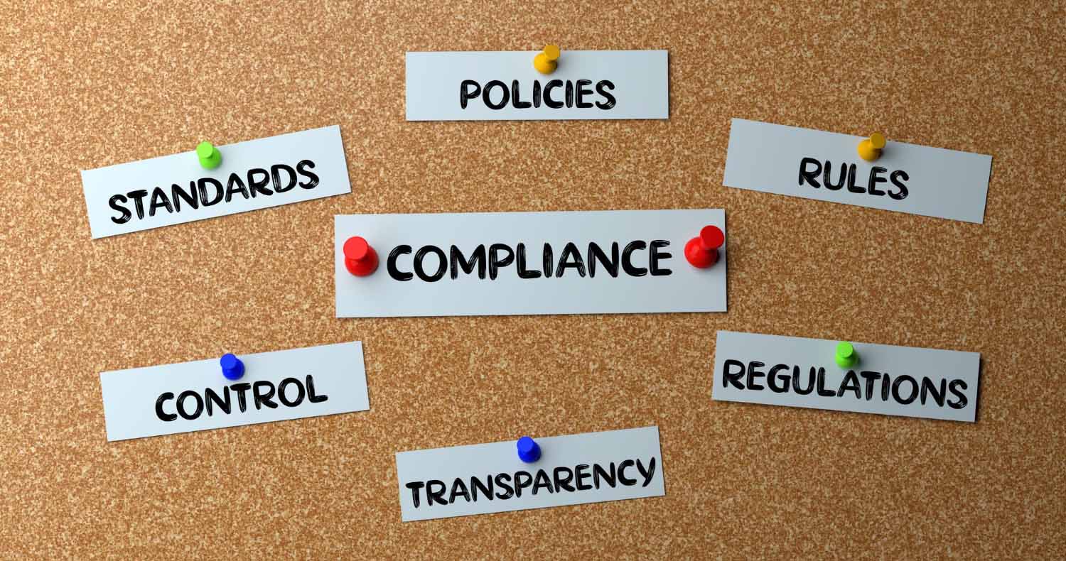 Words on a board with compliance in the center